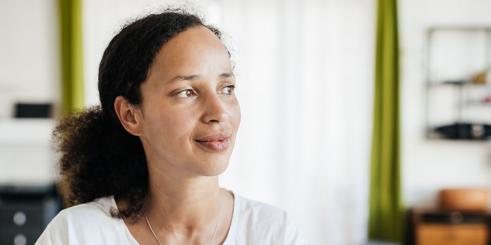 woman looking off to the side thoughtfully